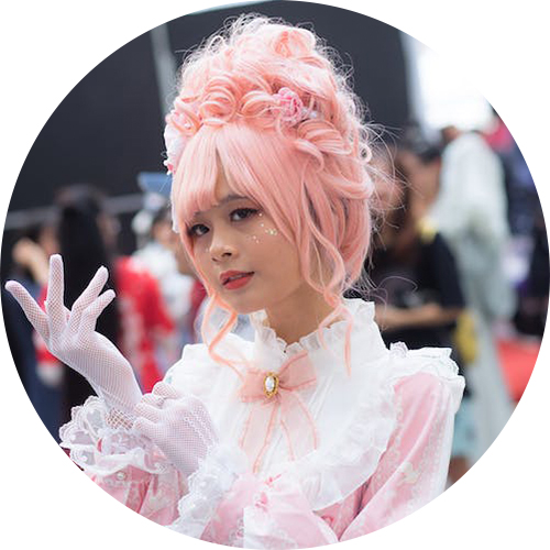 Headshot of Niki N a cosplayer with pink hair